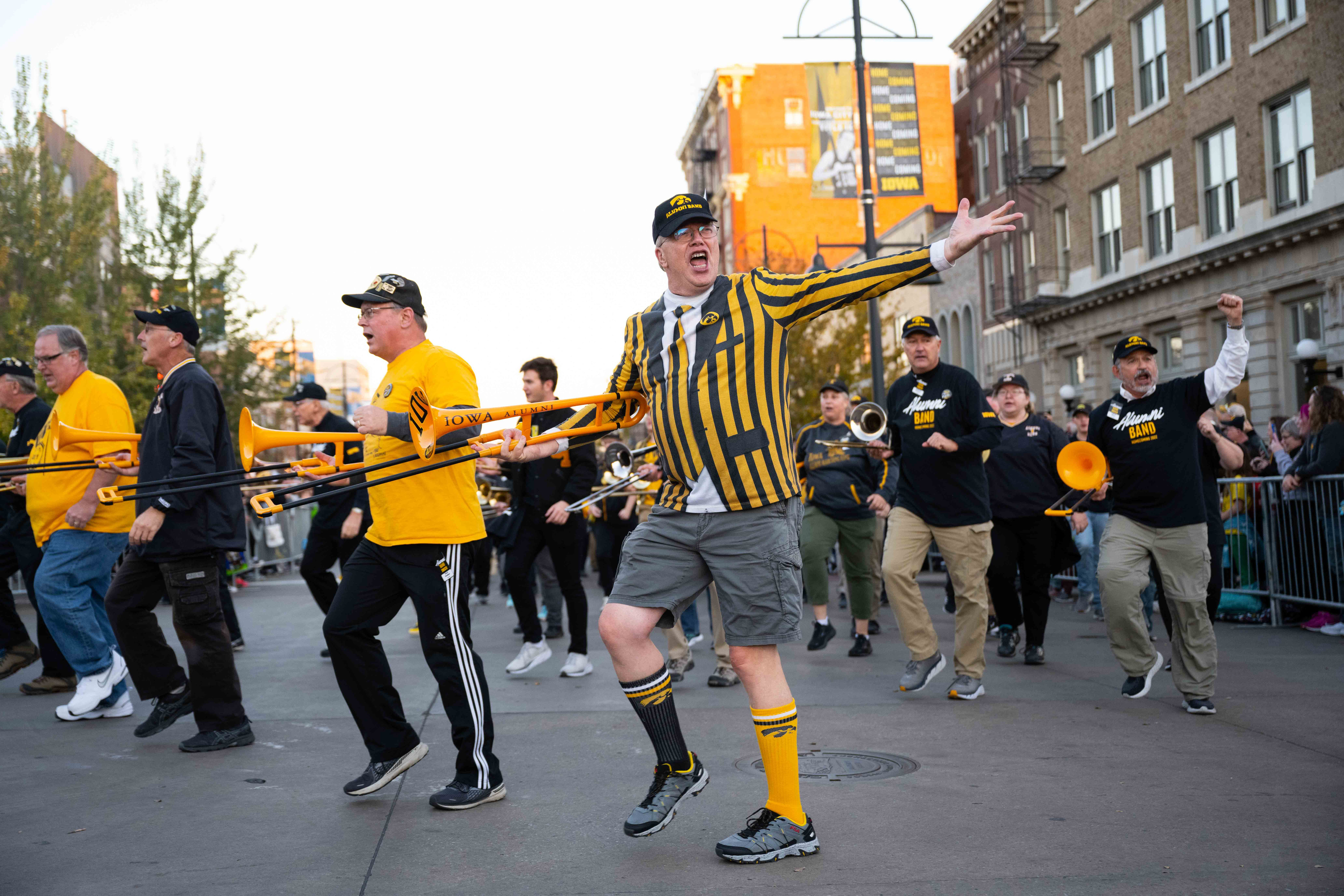 Members of the Iowa Alumni Marching Band marching in the 2022 Homecoming Parade