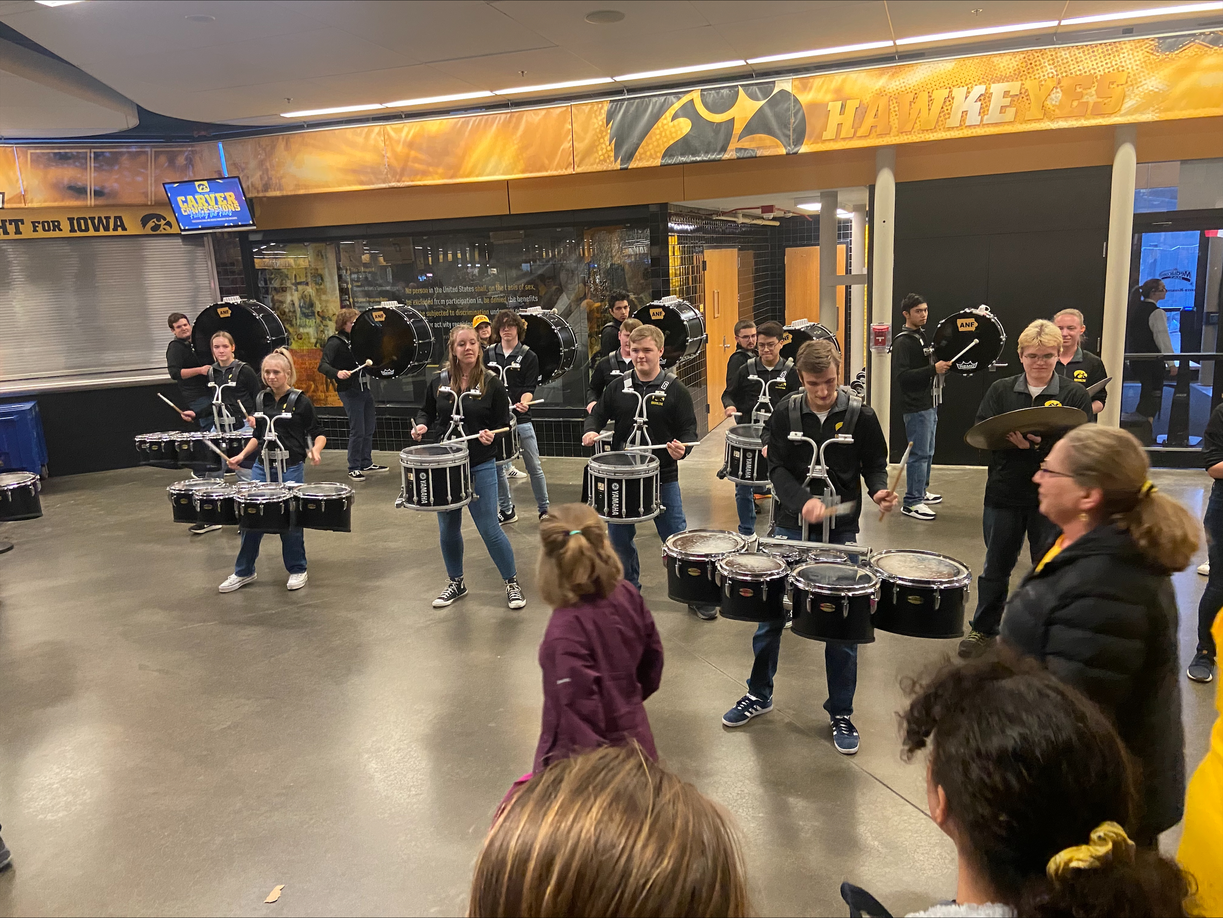 Black and Gold Drumline performing on the concourse at Carver Hawkeye Arena