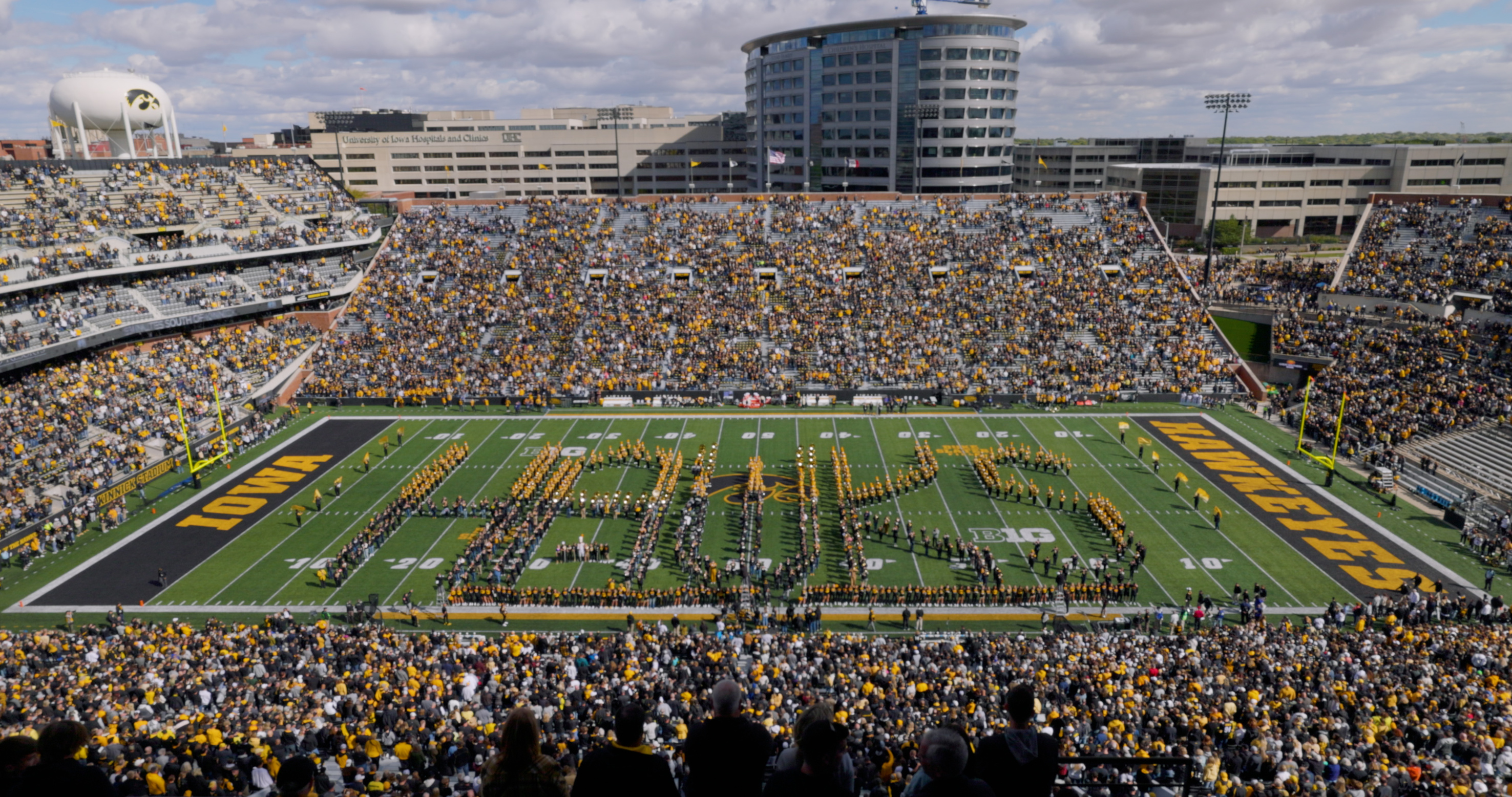 HMB and the Alumni Band in the "Super Hawks" formation on the field during Homecoming Pregame 2023