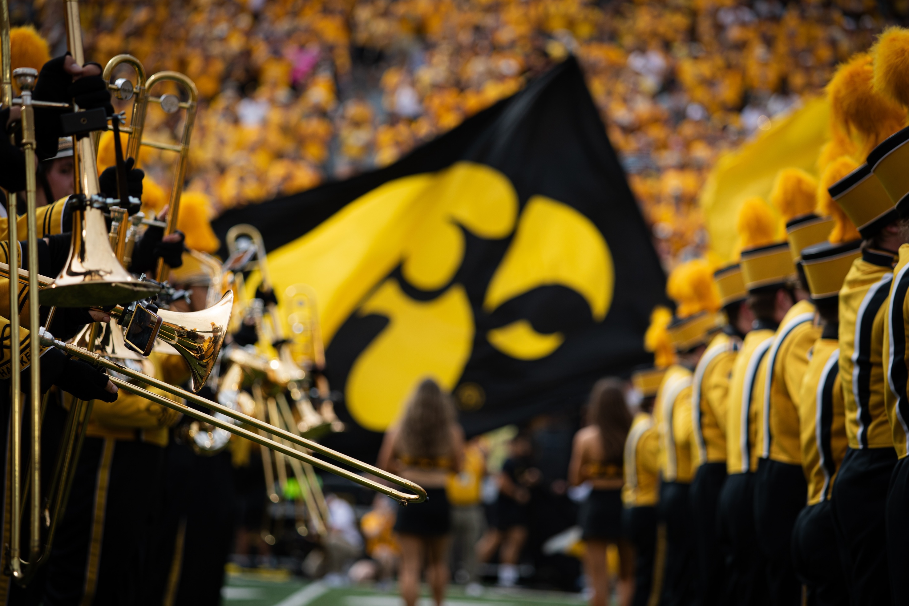 Horns in Kinnick Stadium on game day with Tigerhawk flag in background