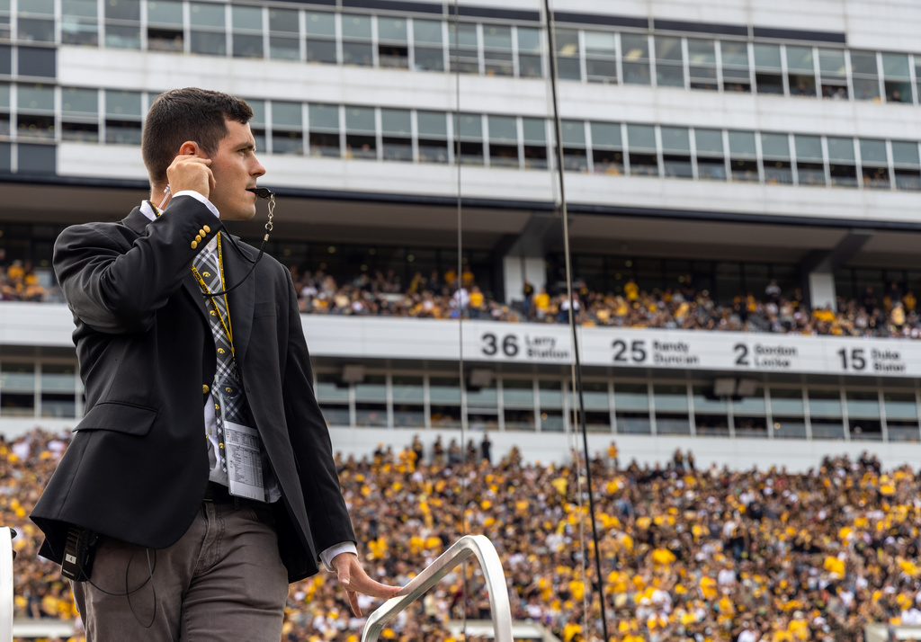Nick Miller on the ladder during a game in Kinnick Stadium