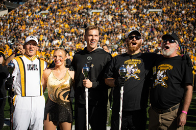 Alumni Drum Majors with current Drum Major and Golden Girl