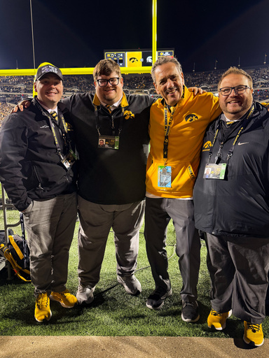 Hawkeye Marching Band Directors and staff with Bob Shomper in Kinnick Stadium