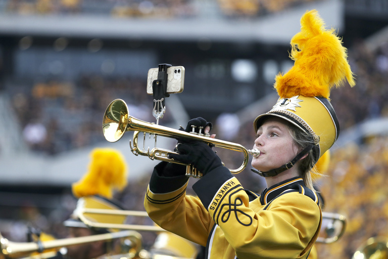 Trumpet player performing in Kinnick Stadium