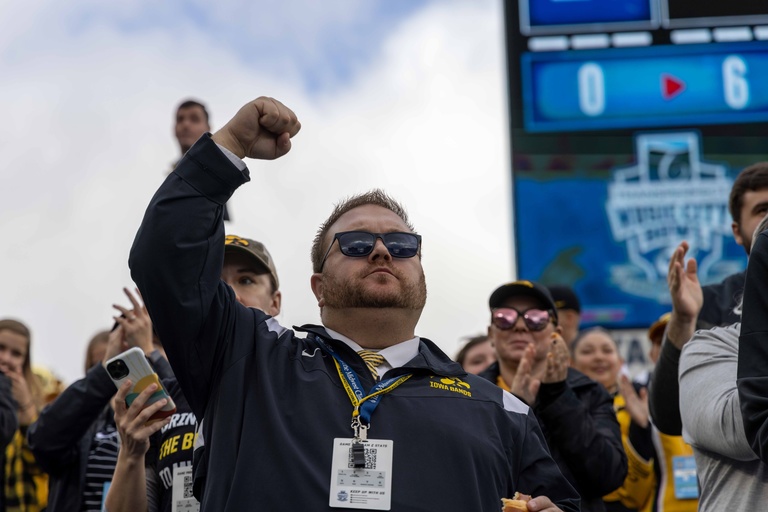 Dr. Eric W. Bush cheers on the Hawkeyes at the 2022 Music City Bowl in Nashville, TN