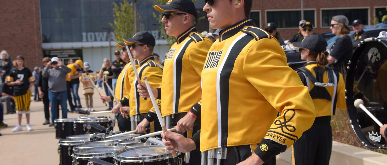 Quad players performing during the Hawkeye Drumline lot show