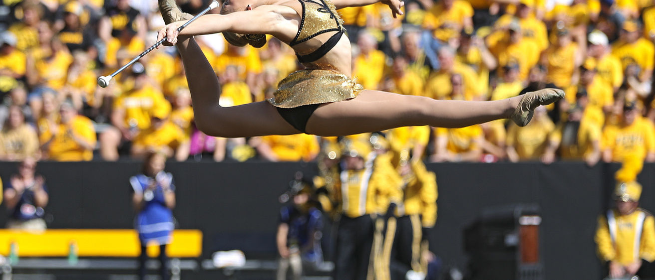 Ella McDaniel leaping in Kinnick Stadium