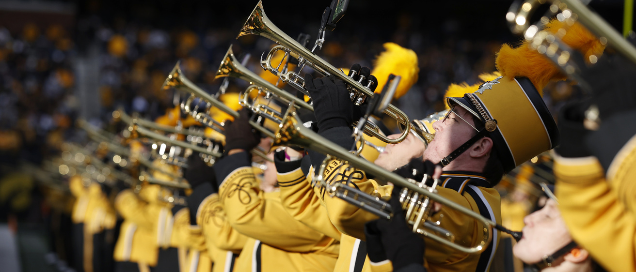 Trumpet players performing in Kinnick Stadium