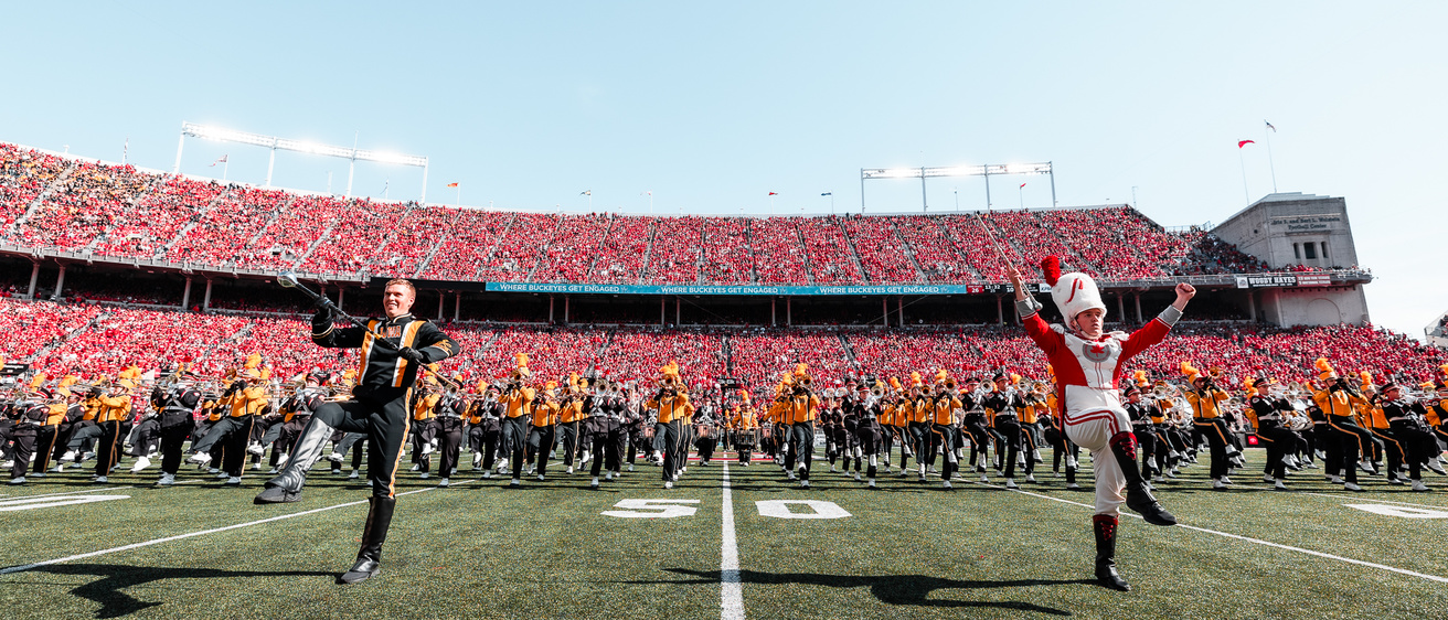 Iowa Drum Major Christian Frankl and Ohio State Drum Major performing with the marching bands
