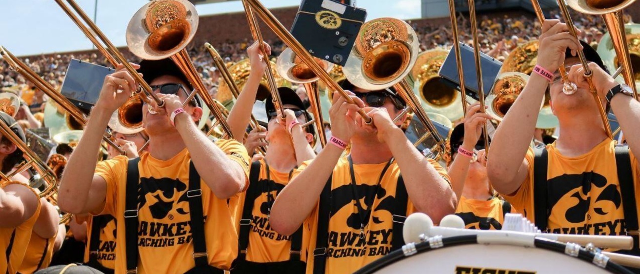 Hawkeye Marching Band trombones performing in the stands at Kinnick Stadium