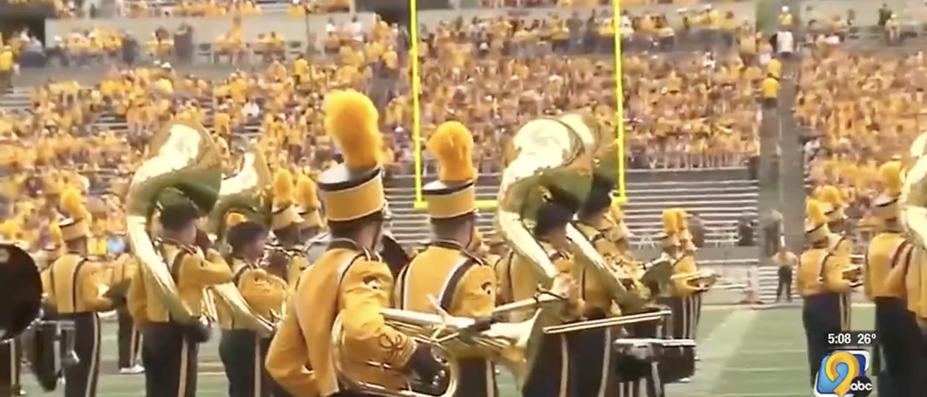 Hawkeye Marching Band performing in Kinnick Stadium