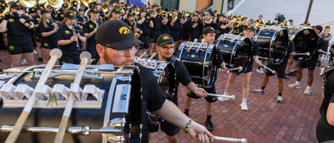 Bass drums performing at Pointe Orlando for a pep rally at the 2024 Citrus Bowl