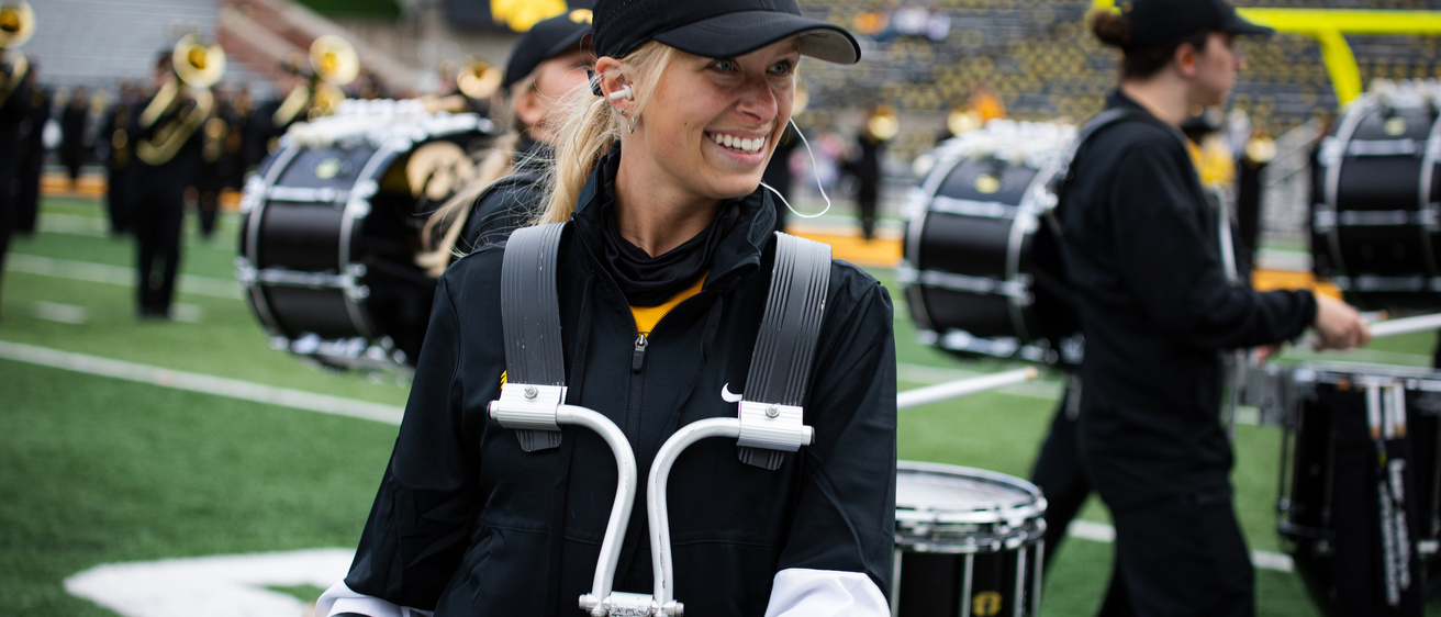 Member of the quad section of the Hawkeye Drumline performing during the Crossover at Kinnick game in Kinnick Stadium