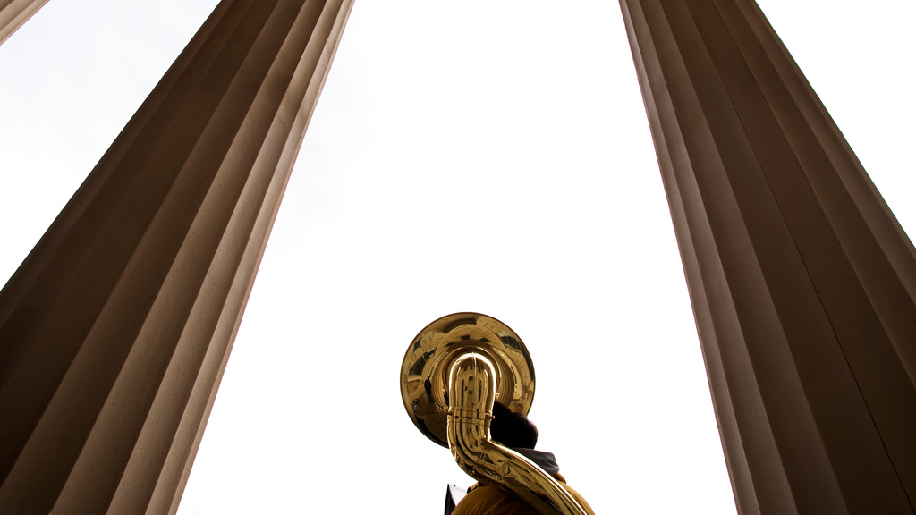 A sousaphone photographed between columns on the Old Capitol
