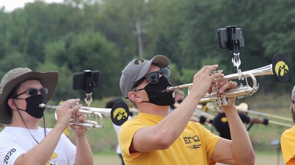 Trumpet players wearing masks