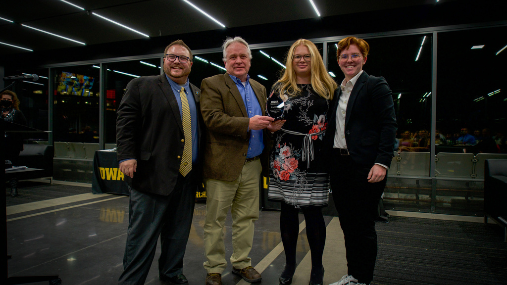 HMB Director Dr. Eric Bush and Drum Major Amanda Thomas with Brian McClatchey and Mia Brunelli of CAMBUS