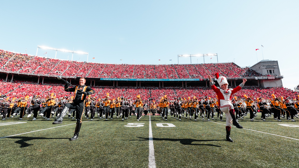 Iowa Drum Major Christian Frankl and Ohio State Drum Major performing with the marching bands