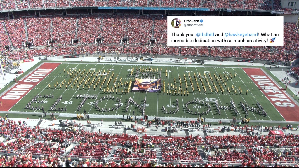 HMB and OSUMB in performance, with Tweet from Sir Elton John in upper right hand corner