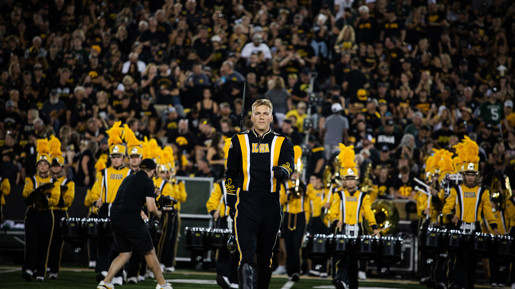Drum Major Christian Frankl leads the HMB onto the field for Halftime in Kinnick Stadium