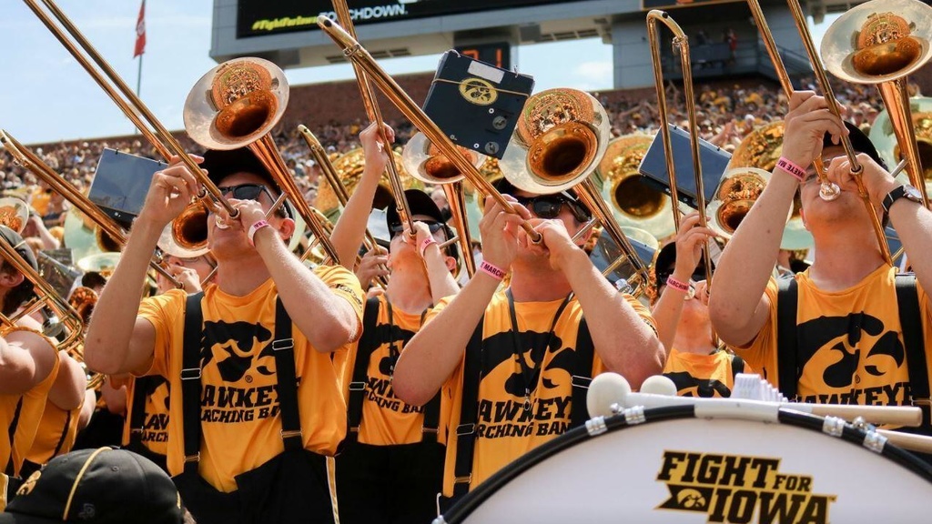 Hawkeye Marching Band trombones performing in the stands at Kinnick Stadium