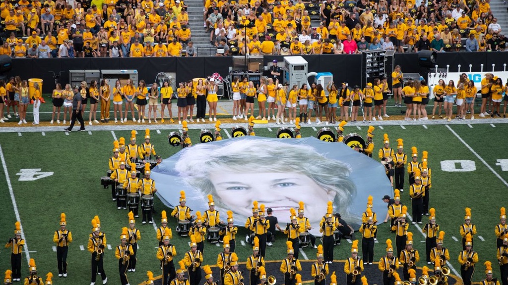  Iowa Marching Band holds up a banner of Lisa Bluder during halftime at a football game between Iowa and Troy at Kinnick Stadium on Saturday, Sept. 14, 2024